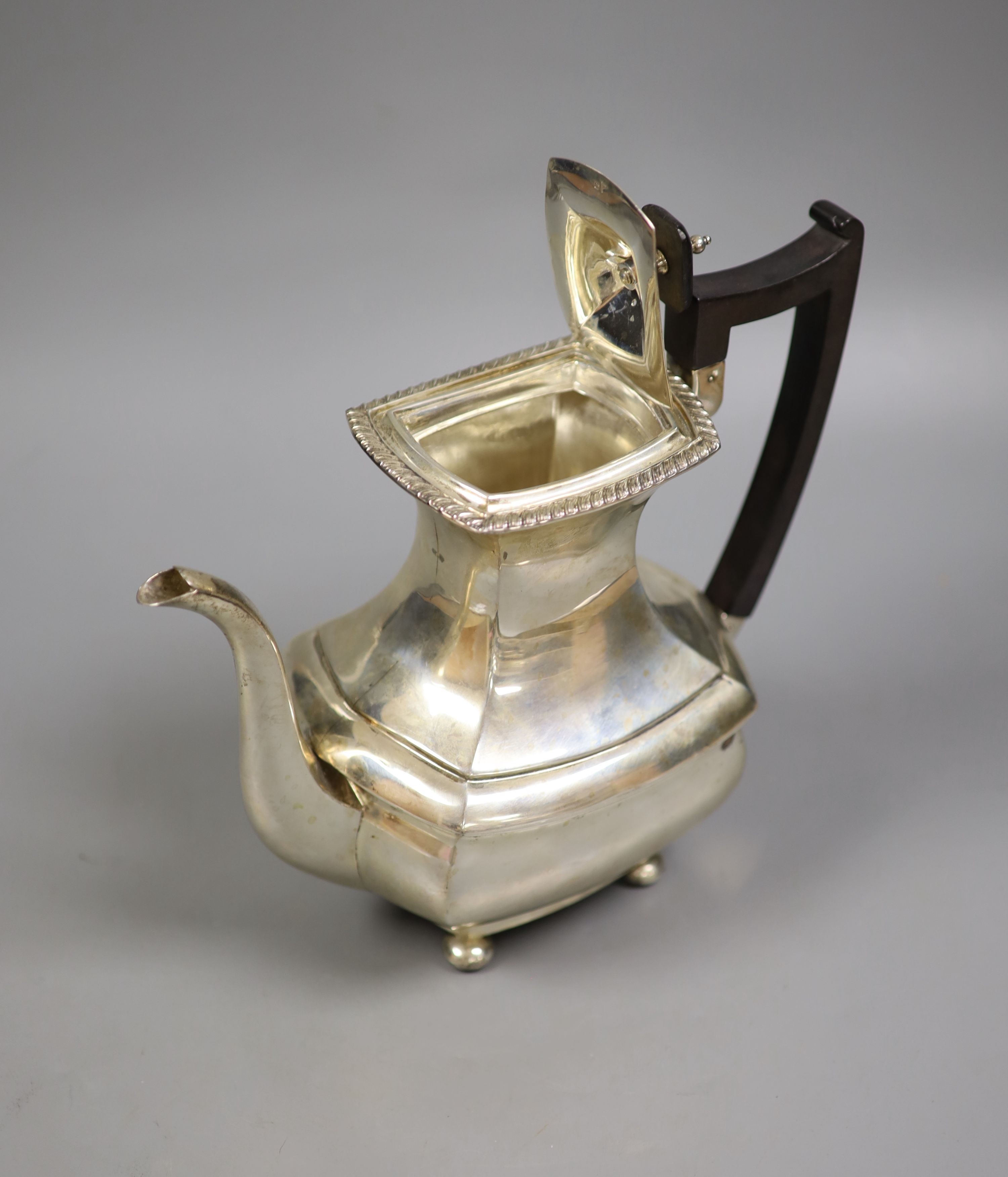 A George V silver coffee pot, by Walker & Hall, Sheffield, 1913, gross 27oz.